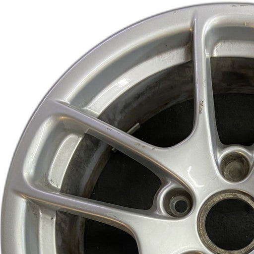 18" PORSCHE BOXSTER 17-24 18x8 5 spoke triangle spoke Original OEM Wheel Rim - Angle View