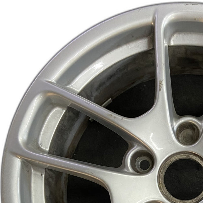 18" PORSCHE BOXSTER 17-24 18x8 5 spoke triangle spoke Original OEM Wheel Rim - Angle View