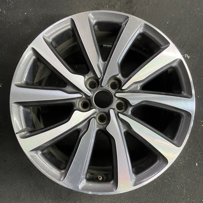18" MKC 19 18x8 , 10 spoke, machined face with pockets Original OEM Wheel Rim - Angle View