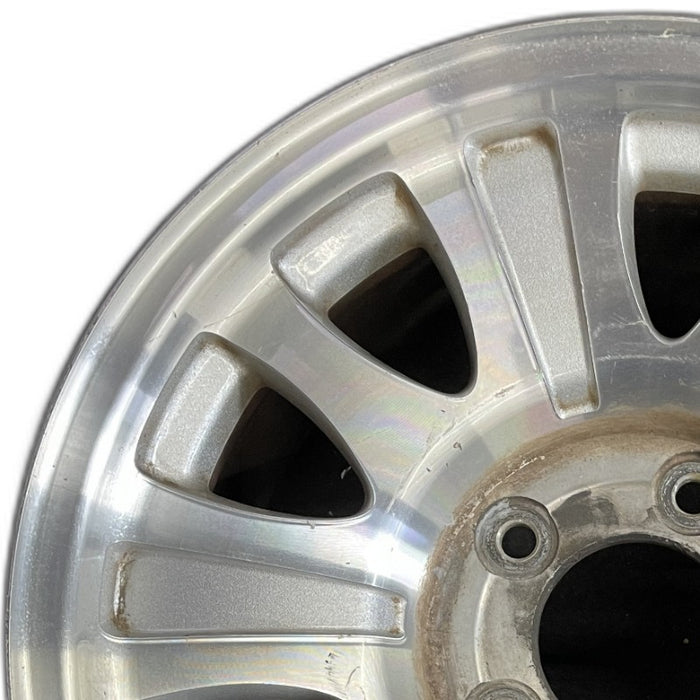 17" EXPEDITION 01-02 14mm lug 16mm hole 17x7.5 aluminum 10 triangular holes beige in pockets Original OEM Wheel Rim