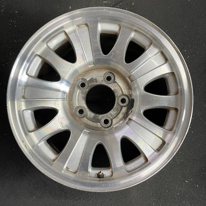 17" EXPEDITION 01-02 14mm lug 16mm hole 17x7.5 aluminum 10 triangular holes beige in pockets Original OEM Wheel Rim