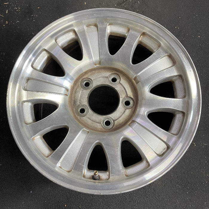 17" EXPEDITION 01-02 14mm lug 16mm hole 17x7.5 aluminum 10 triangular holes beige in pockets Original OEM Wheel Rim