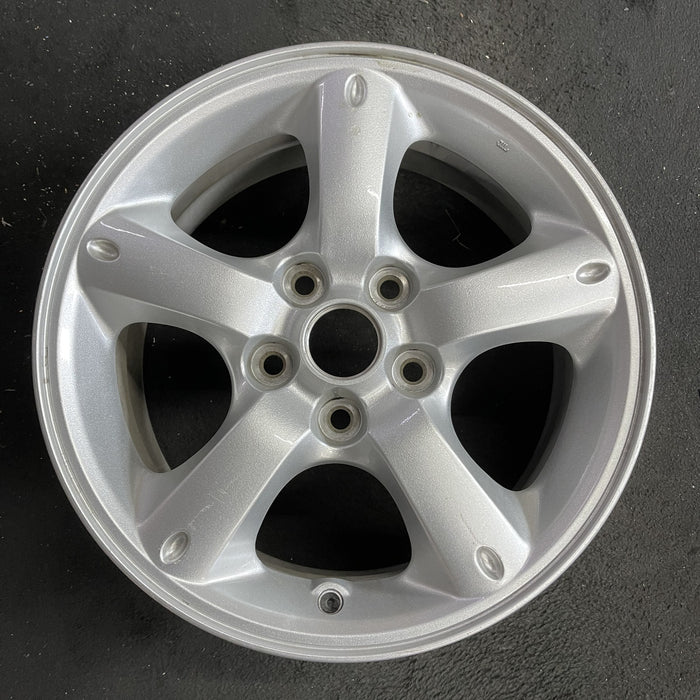 16" MAZDA TRIBUTE 05-06 16x7, , oval dimples ends Original OEM Wheel Rim - Angle View