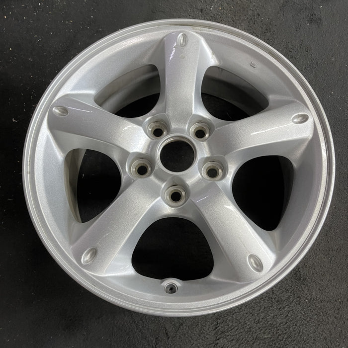 16" MAZDA TRIBUTE 05-06 16x7, , oval dimples ends Original OEM Wheel Rim - Side Profile