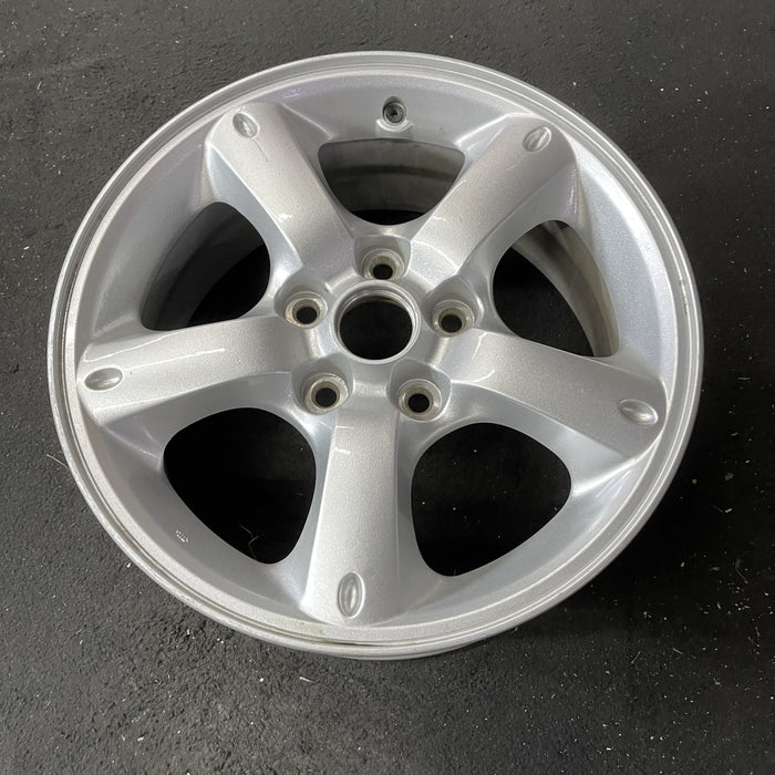 16" MAZDA TRIBUTE 05-06 16x7, , oval dimples ends Original OEM Wheel Rim - Close-Up Detail