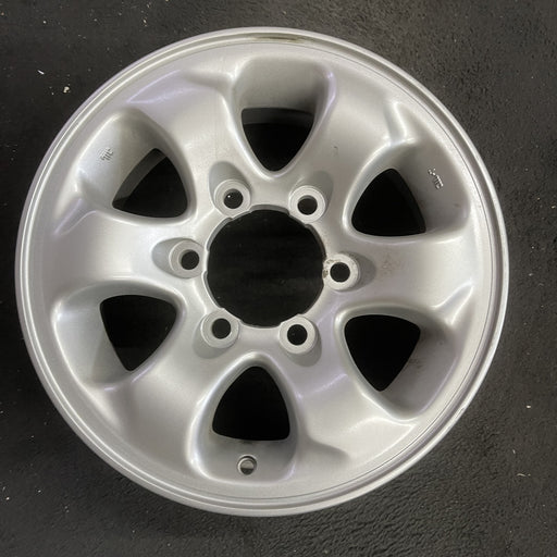 15" MONTERO 94-02 15x6, alloy Original OEM Wheel Rim - Angle View
