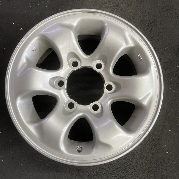 15" MONTERO 94-02 15x6, alloy Original OEM Wheel Rim - Angle View