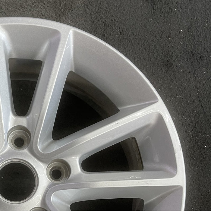 17" CARAVAN 13 17x6.5 aluminum V spoke fully opt WGH Original OEM Wheel Rim - Close-Up Detail