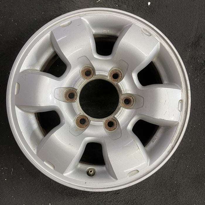 15" PATHFINDER 96 15x7, alloy, SE Original OEM Wheel Rim - Angle View
