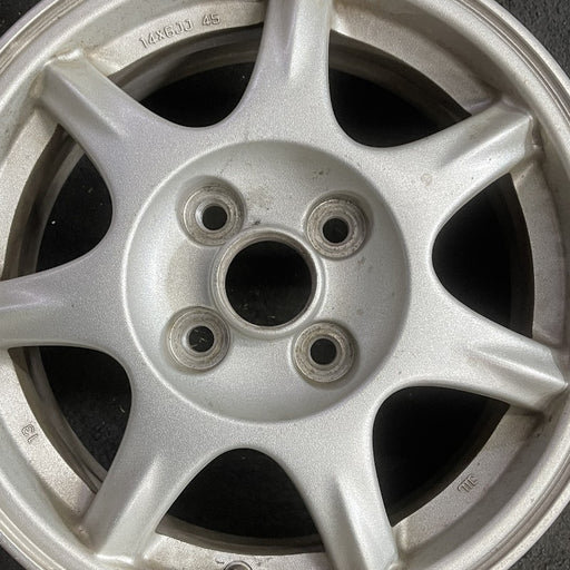 14" MAZDA MX-5 MIATA 94 14x6 alloy 7 spoke pewter Original OEM Wheel Rim - Angle View