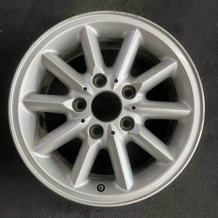 15" BMW 318i 95-99 15x7 , 10 spoke, round spoke Original OEM Wheel Rim - Angle View