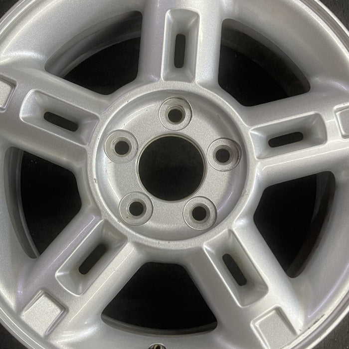 16" EXPLORER 02-03 4 Dr exc. Sport Trac; 16x7 aluminum 5 double spokes w/openings in spokes sparkle silver finish Original OEM Wheel Rim