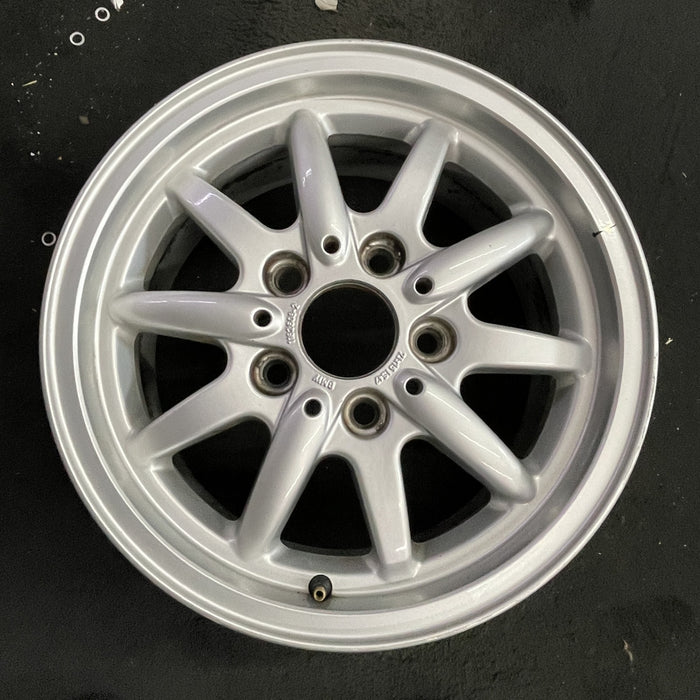 15" BMW 318i 95-96 15x7 , 10 spoke, flat face spoke, alternating spoke height - Angle View