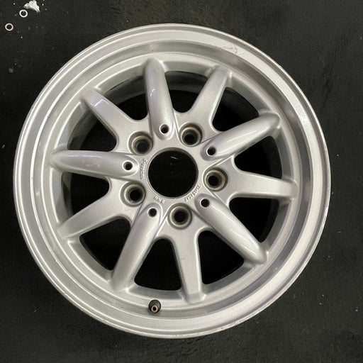 15" BMW 318i 95-96 15x7 , 10 spoke, flat face spoke, alternating spoke height - Angle View