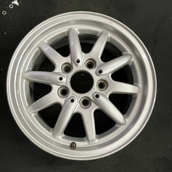 15" BMW 318i 95-96 15x7 , 10 spoke, flat face spoke, alternating spoke height - Angle View