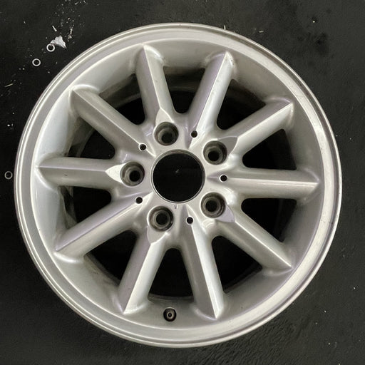 15" BMW 318i 95-99 15x7 , 10 spoke, round spoke Original OEM Wheel Rim - Angle View
