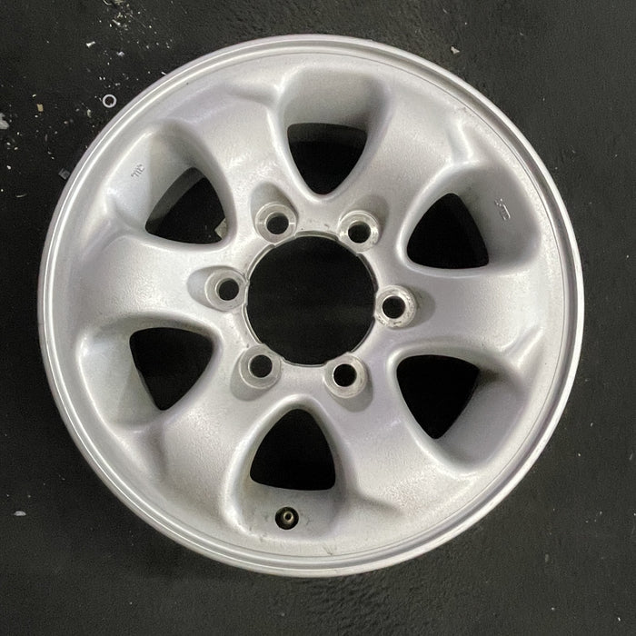 15" MONTERO 94-02 15x6, alloy Original OEM Wheel Rim - Angle View