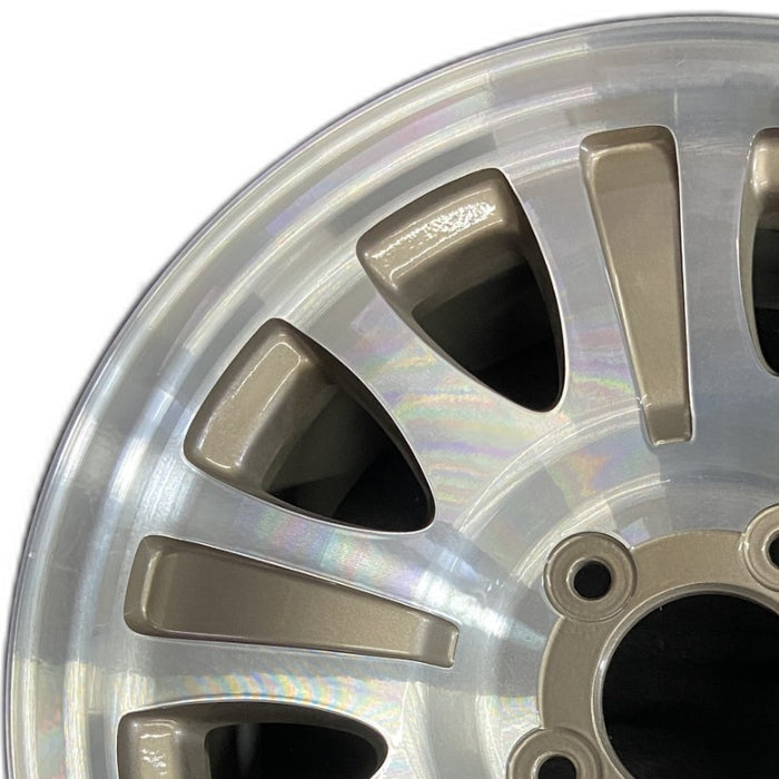 17" EXPEDITION 01-02 14mm lug 16mm hole 17x7.5 aluminum 10 triangular holes beige in pockets Original OEM Wheel Rim