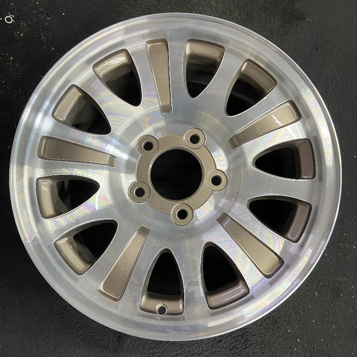 17" EXPEDITION 01-02 14mm lug 16mm hole 17x7.5 aluminum 10 triangular holes beige in pockets Original OEM Wheel Rim