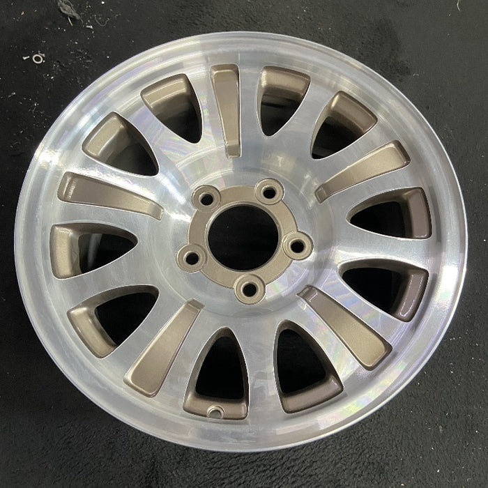 17" EXPEDITION 01-02 14mm lug 16mm hole 17x7.5 aluminum 10 triangular holes beige in pockets Original OEM Wheel Rim