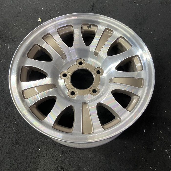 17" EXPEDITION 01-02 14mm lug 16mm hole 17x7.5 aluminum 10 triangular holes beige in pockets Original OEM Wheel Rim