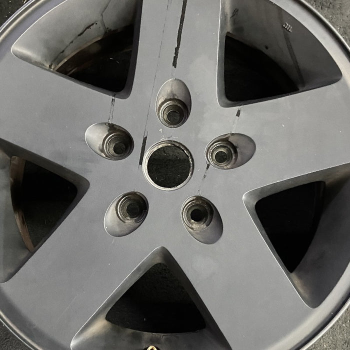 17" WRANGLER 10 17x7.5 5 spoke w/o beadlock; finish gray Original OEM Wheel Rim - Angle View