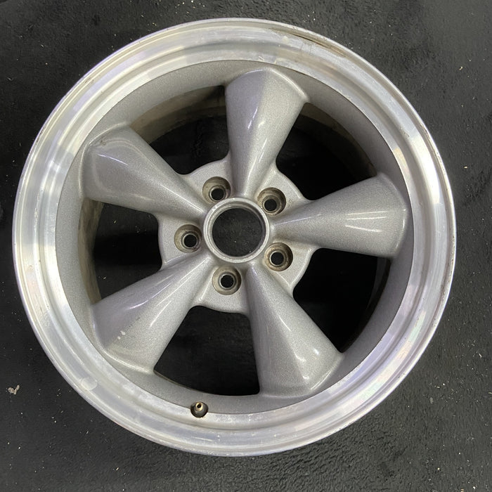 17" MUSTANG 00 17x8, , w/exposed lug nuts, funnel spoke Original OEM Wheel Rim - Angle View