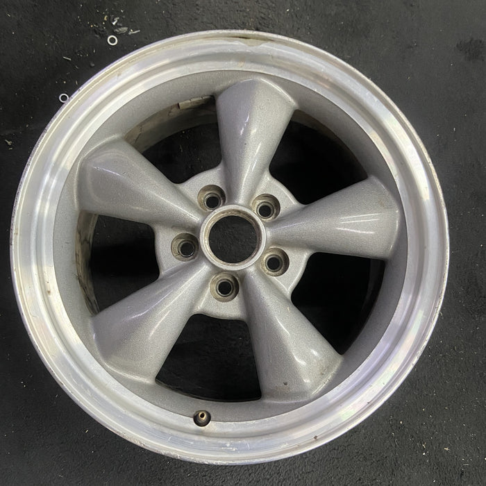 17" MUSTANG 00 17x8, , w/exposed lug nuts, funnel spoke Original OEM Wheel Rim - Angle View