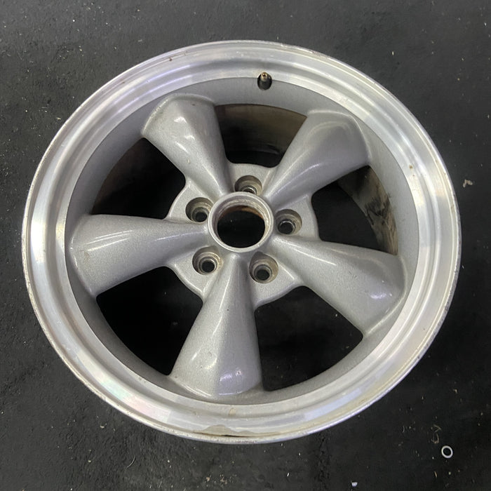 17" MUSTANG 00 17x8, , w/exposed lug nuts, funnel spoke Original OEM Wheel Rim - Close-Up Detail
