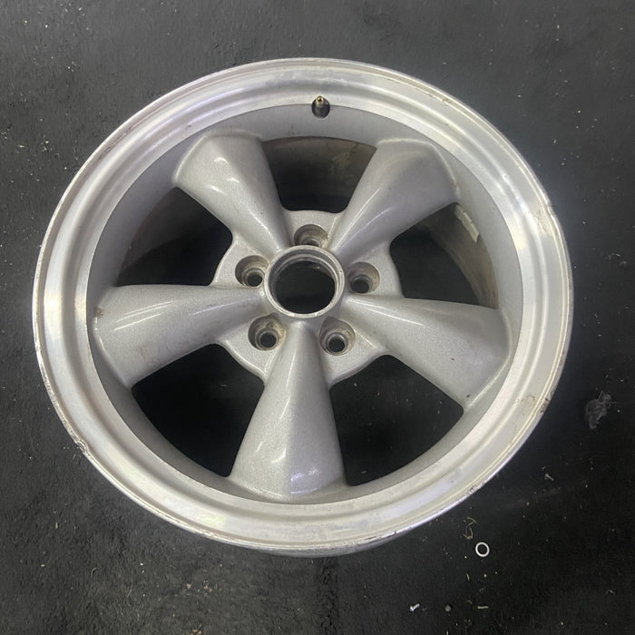 17" MUSTANG 00 17x8, , w/exposed lug nuts, funnel spoke Original OEM Wheel Rim - Close-Up Detail