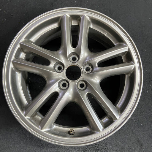 16" IMPREZA 04-05 16x6.5 , 10 spoke, peaked spoke Original OEM Wheel Rim - Angle View