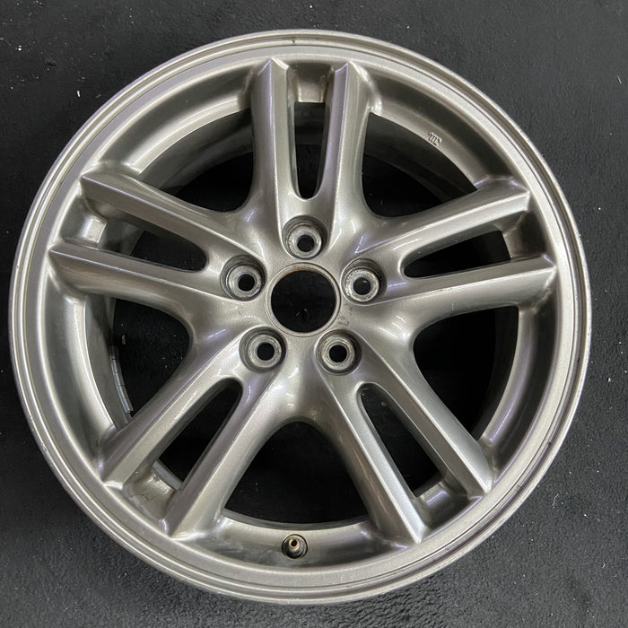 16" IMPREZA 04-05 16x6.5 , 10 spoke, peaked spoke Original OEM Wheel Rim - Angle View