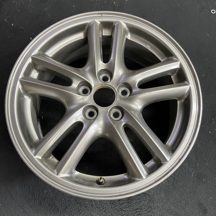 16" IMPREZA 04-05 16x6.5 , 10 spoke, peaked spoke Original OEM Wheel Rim - Side Profile