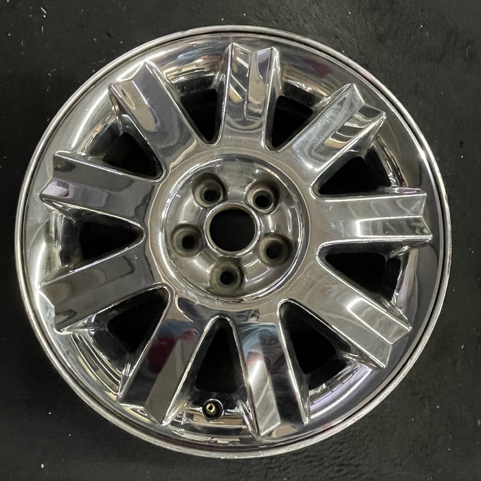 16" SEBRING 04-05 Conv, 16x6.5 , 9 spoke , chrome Original OEM Wheel Rim - Angle View