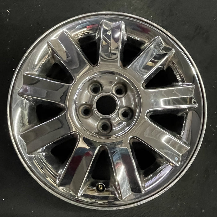 16" SEBRING 04-05 Conv, 16x6.5 , 9 spoke , chrome Original OEM Wheel Rim - Angle View