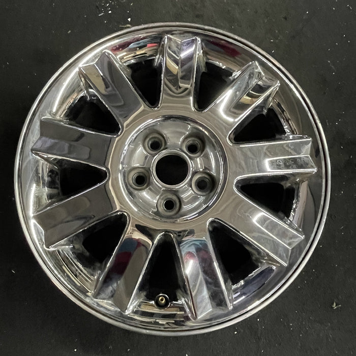 16" SEBRING 04-05 Conv, 16x6.5 , 9 spoke , chrome Original OEM Wheel Rim - Angle View