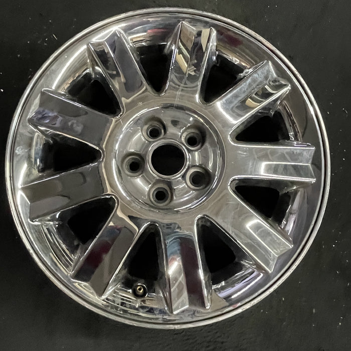 16" SEBRING 04-05 Conv, 16x6.5 , 9 spoke , chrome Original OEM Wheel Rim - Angle View