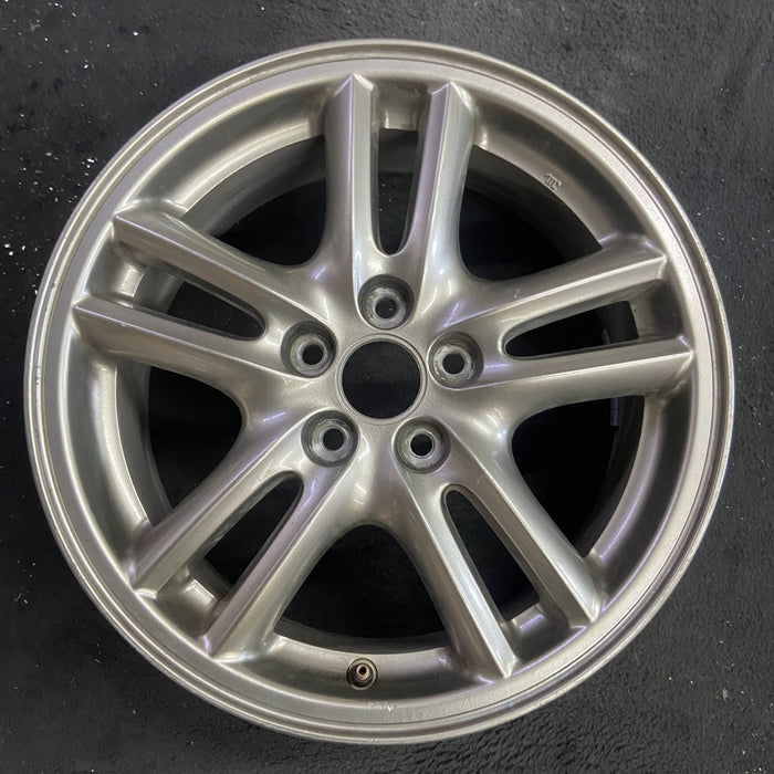 16" IMPREZA 04-05 16x6.5 , 10 spoke, peaked spoke Original OEM Wheel Rim - Angle View