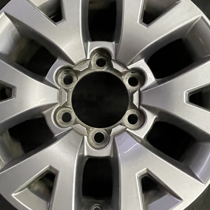 16" TACOMA 16 16x7 alloy 6 spoke V spoke silver Original OEM Wheel Rim - Angle View