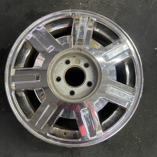 16" DEVILLE 03-05 5 lug, Base, 16x7, , chrome, opt QC6 Original OEM Wheel Rim - Angle View