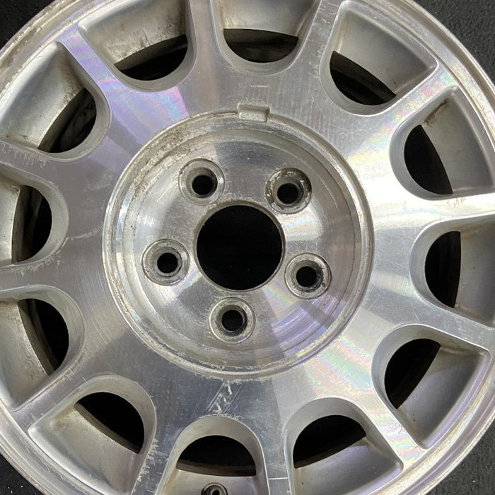 15" TAURUS 98-99 15x6 aluminum 12-windows dark argent Original OEM Wheel Rim - Angle View