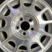 15" TAURUS 98-99 15x6 aluminum 12-windows dark argent Original OEM Wheel Rim - Angle View