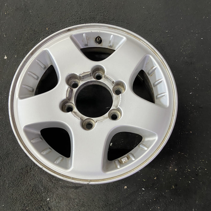 15" CANYON 04-08 15x6.5, 4x4, , smooth spokes Original OEM Wheel Rim - Close-Up Detail