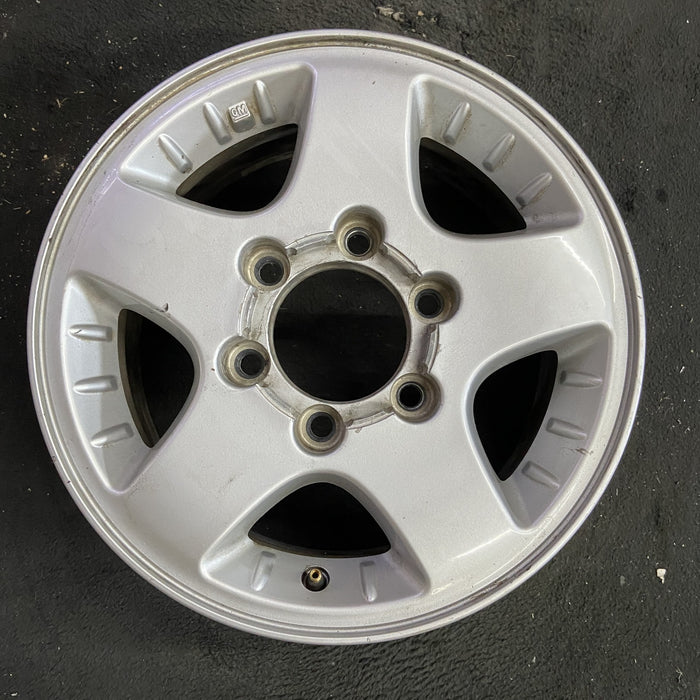 15" CANYON 04-08 15x6.5, 4x4, , smooth spokes Original OEM Wheel Rim - Angle View