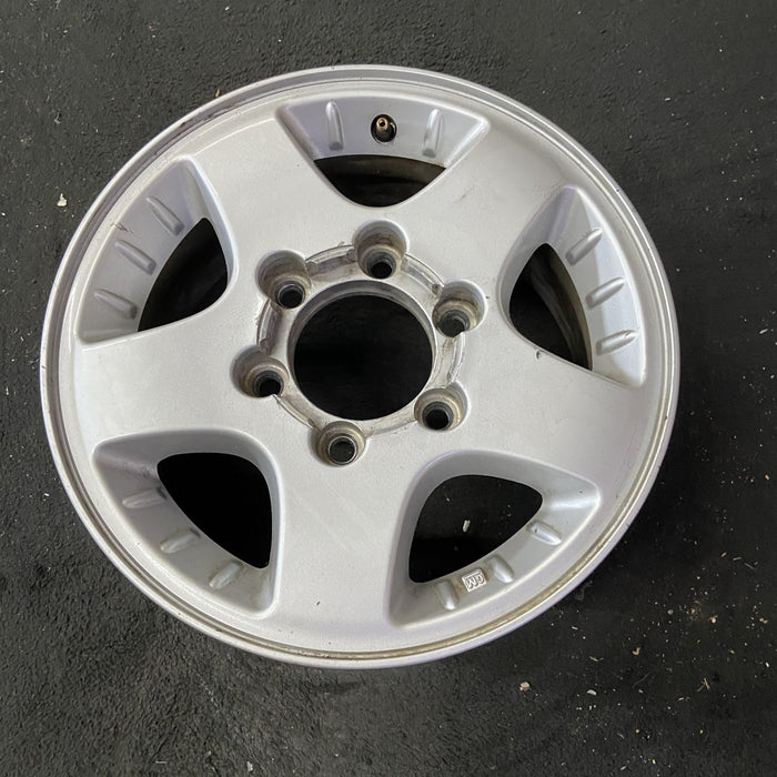 15" CANYON 04-08 15x6.5, 4x4, , smooth spokes Original OEM Wheel Rim - Close-Up Detail