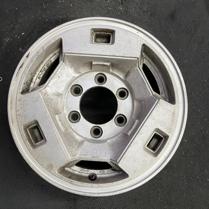 15" NISSAN PICKUP 86 D21, 4x4, 15x7 , front Original OEM Wheel Rim - Angle View
