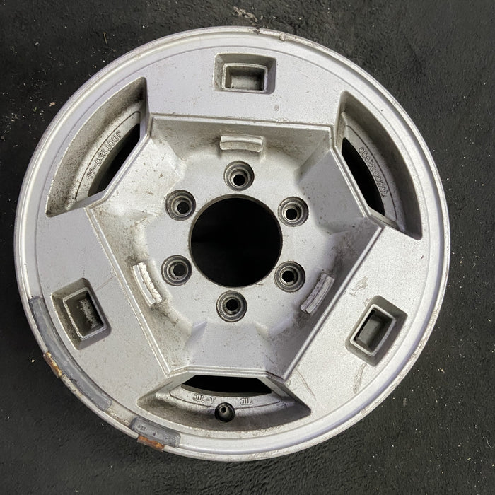 15" NISSAN PICKUP 86 D21, 4x4, 15x7 , front Original OEM Wheel Rim - Angle View
