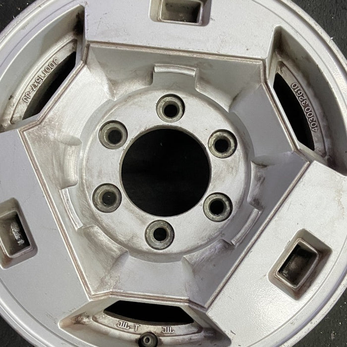 15" NISSAN PICKUP 86 D21 4x4 15x7 alloy frt Original OEM Wheel Rim - Angle View