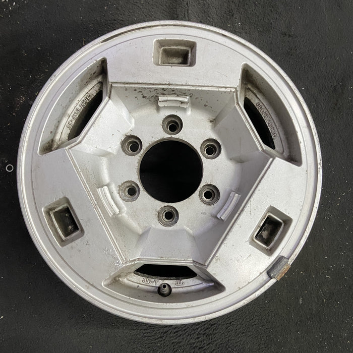 15" NISSAN PICKUP 86 D21, 4x4, 15x7 , front Original OEM Wheel Rim - Angle View