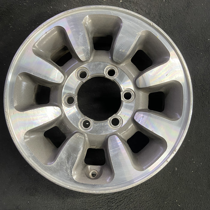 15" MONTERO 92-93 15x6, alloy Original OEM Wheel Rim - Angle View